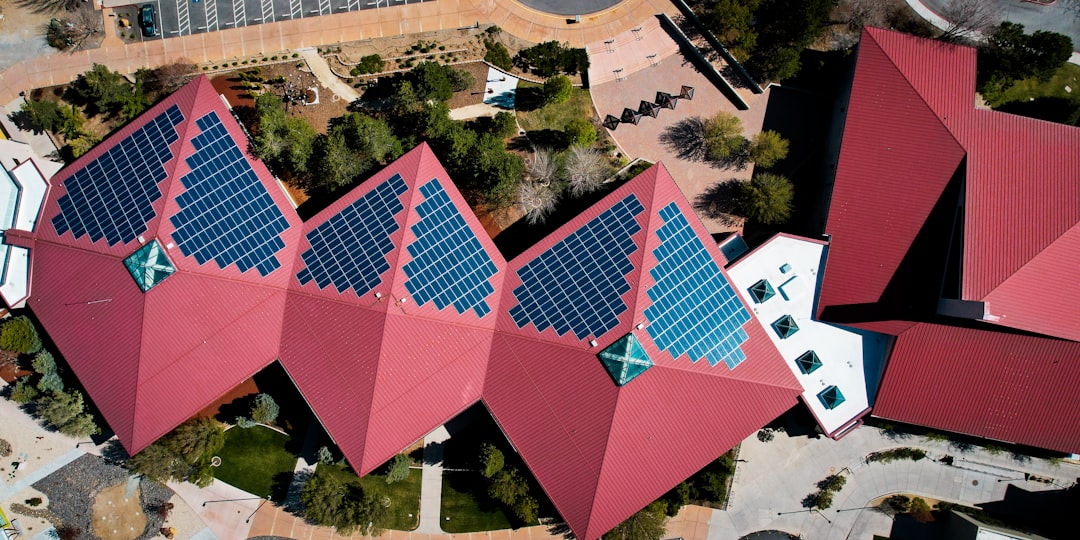 a-group-of-buildings-with-red-roofs-vgf9kogcu1u