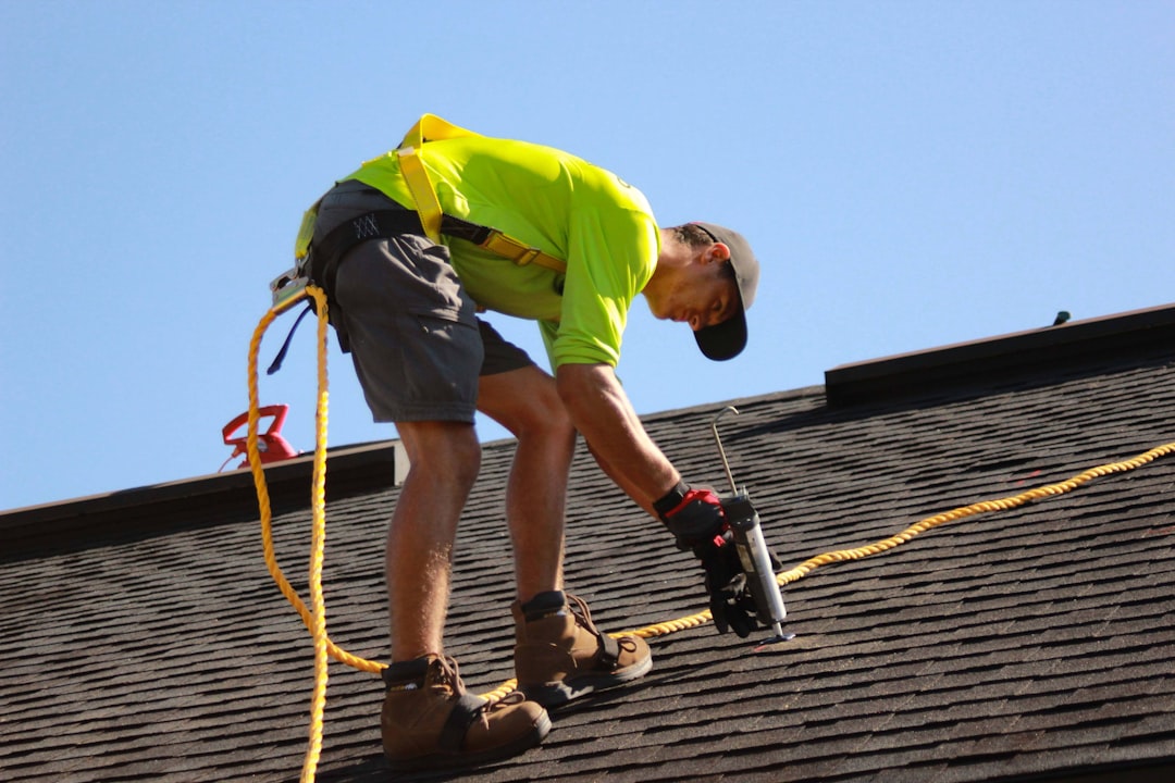 a-man-working-on-a-roof-with-a-power-drill-acnfstblnts
